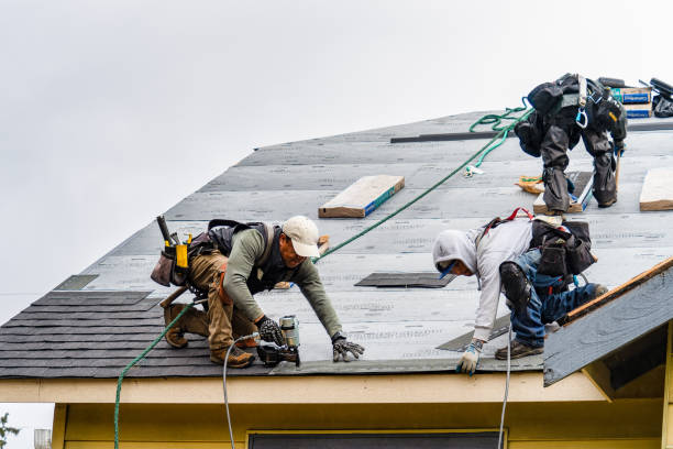 Professional Roofing technician working in Woodburn, IN
